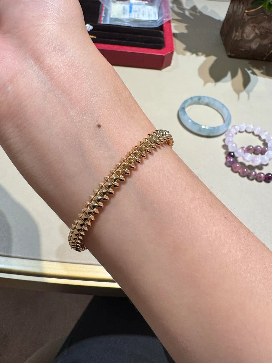 Ensemble deux pièces de la collection «Clash de Cartier»  bracelet et boucles d'oreilles créoles